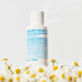 Moisturizer used as makeup primer for a smooth complexion by Malin+Goetz.