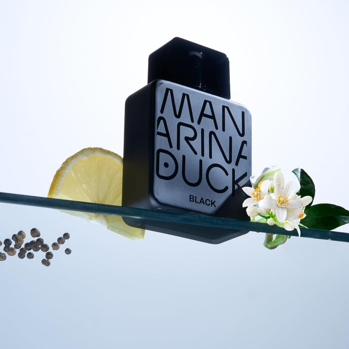 Mandarina Duck Black lifestyle shot suggests sophisticated evening wear