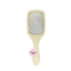 Mane Ready or Knot mini detangling brush close-up showing durable birch wood for gentle detangling.