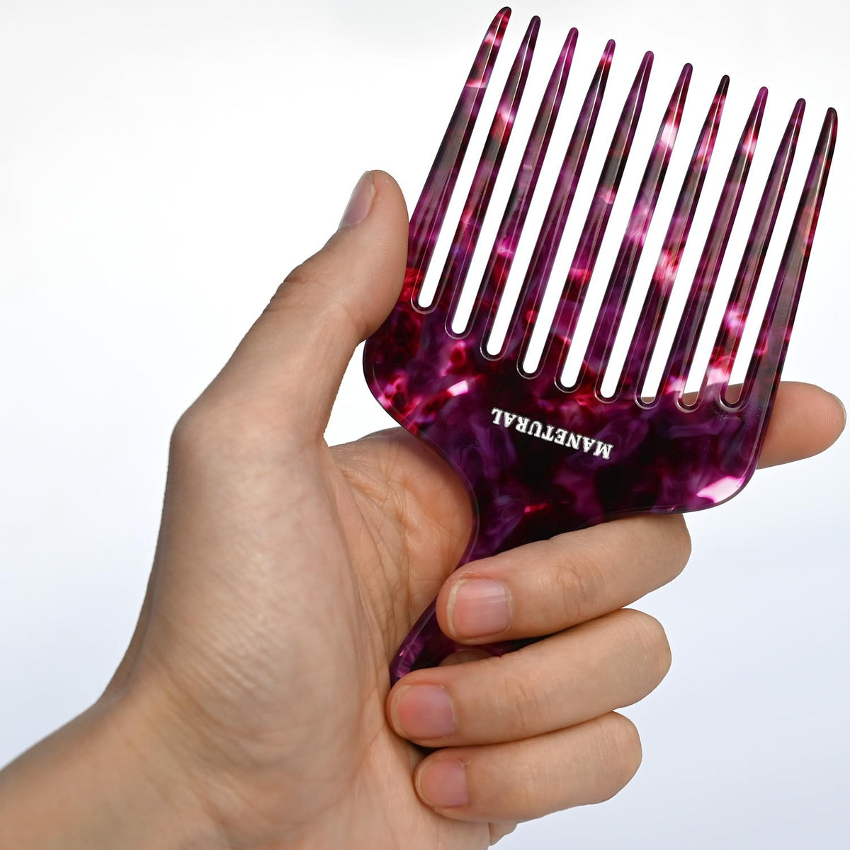 MANETURAL 14MX Afro pick in purple raises volume without pulling.
