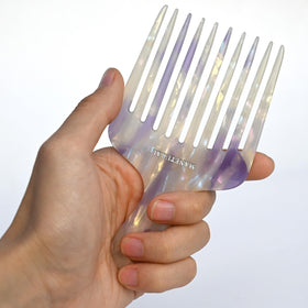 Manetural 14MX afro pick with wide teeth defines curls and reduces knots.