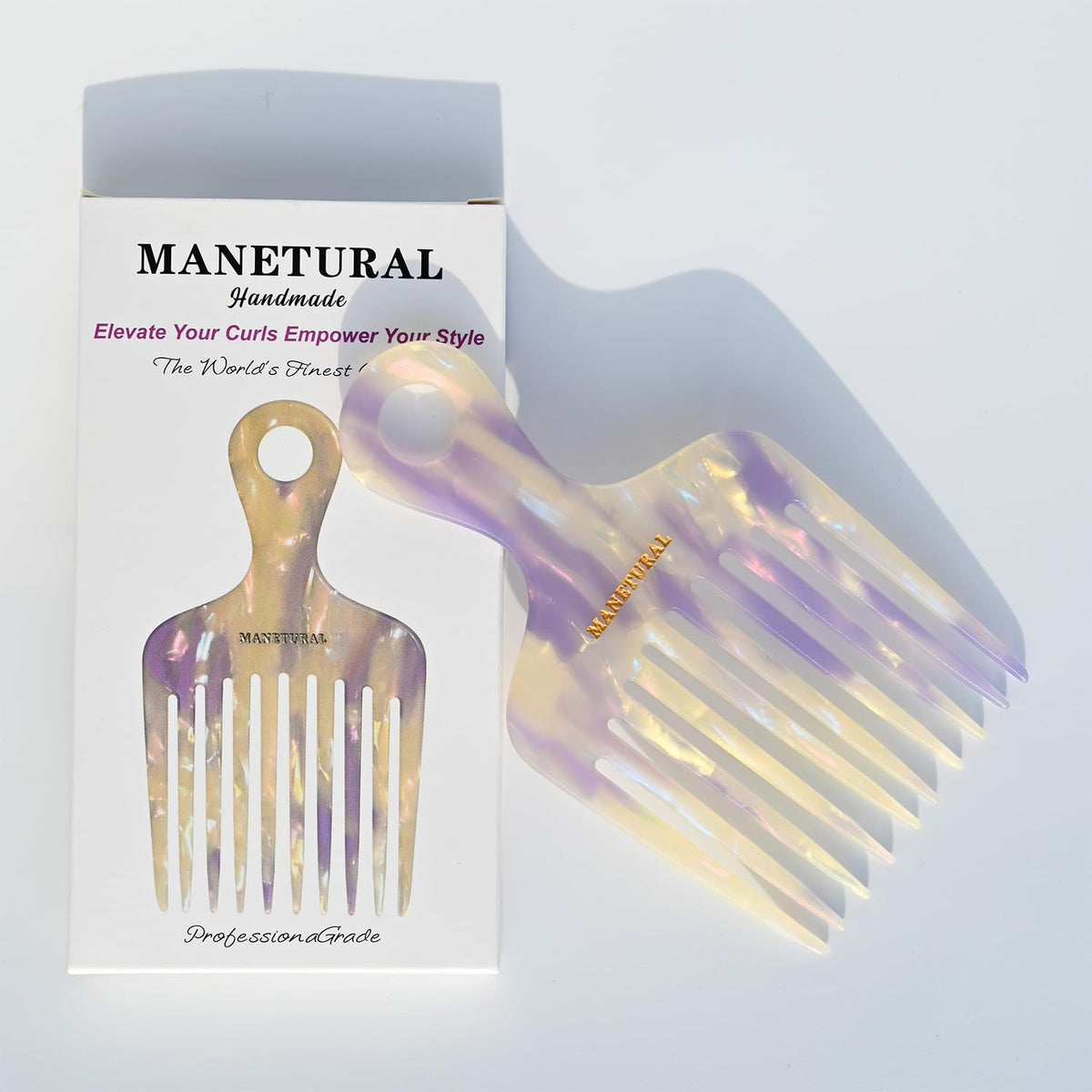 Manetural 14MX hair pick with durable acetate body and smooth teeth for comfortable grooming.
