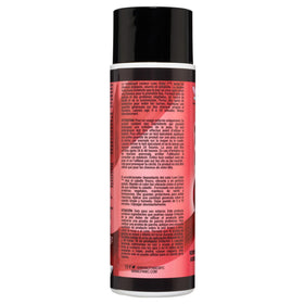 Applying MANIC PANIC Red Desire conditioner on hair for at-home use.