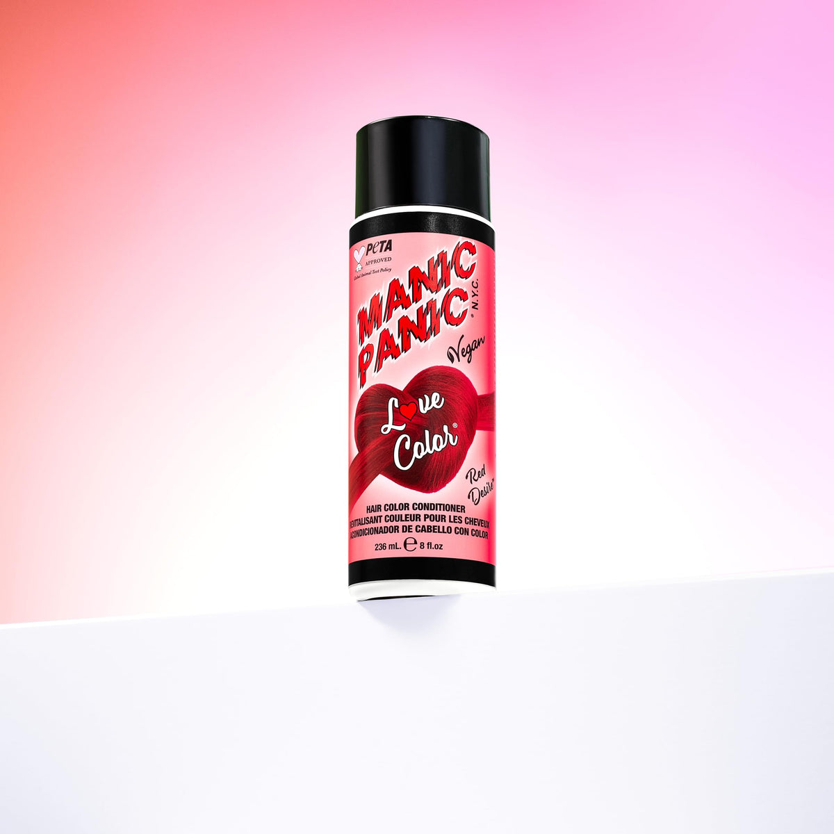 Semi-permanent color refresh with MANIC PANIC Red Desire on color-treated hair.