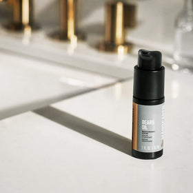 Travel-friendly MANSCAPED Beard Oil bottle for on-the-go care.