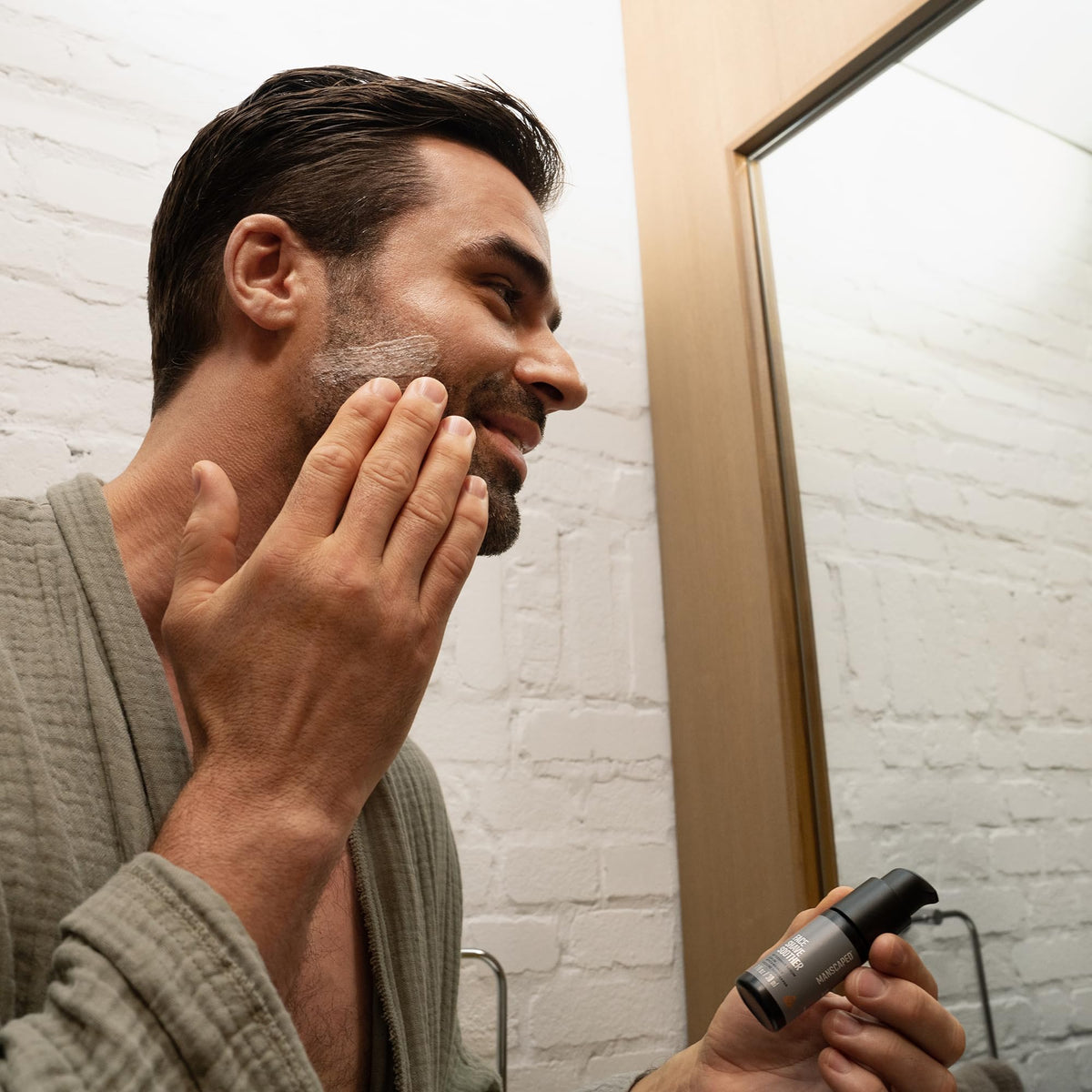 MANSCAPED Face Shave Soother hydration droplets on skin highlight moisture.