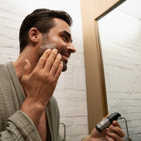MANSCAPED Face Shave Soother hydration droplets on skin highlight moisture.