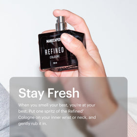 MANSCAPED Refined Cologne glass bottle and wooden cap in a premium presentation.