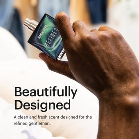 Glass bottle of MANSCAPED Refined Cologne with wooden cap exudes premium masculinity.