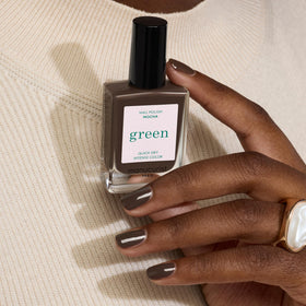 Manucurist Green Base Coat in use for long-lasting manicure prep.