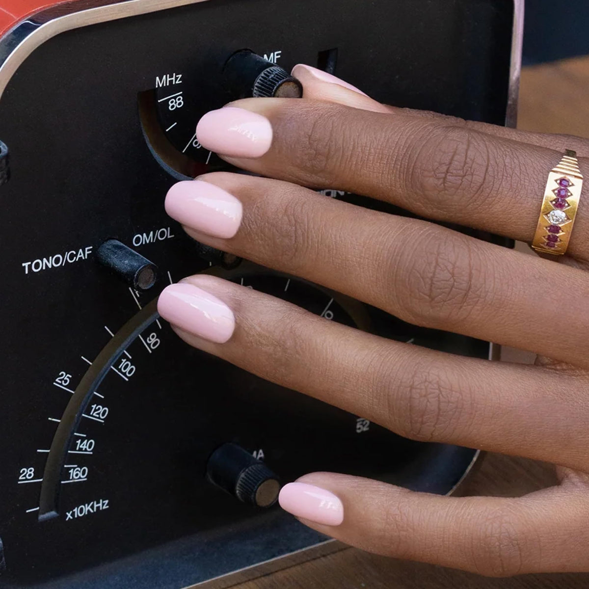 Manucurist Green Dune nail swatches reveal opaque sandy beige with pinky shimmer.