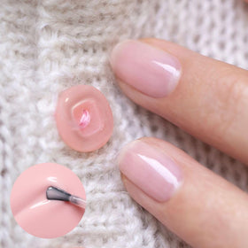 Manucurist Hortencia swatch displays delicate, sheer pink coverage.