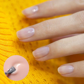 Close-up of Pale Rose brush stroke showing sheer pink coverage.