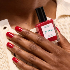 Manucurist Green Pomegranate nail polish close-up on glossy finish.