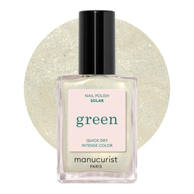Manucurist Green Solar bottle close-up showing quick-dry formula and golden shimmer.