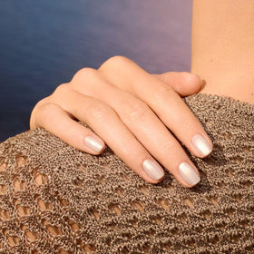 Nails show long-lasting shine with Manucurist Green Solar under warm light.