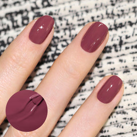 Manucurist Green Victoria Plum nail swatches reveal opaque color without iridescence.