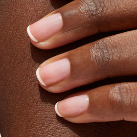 Manucurist natural-looking French glow on nails with fresh finish.