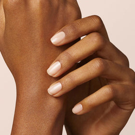 Manucurist Sunshine Top Coat bottle delivering long-lasting shine.