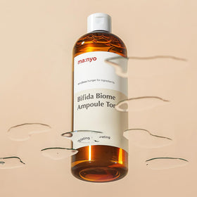 ma:nyo Bifida Biome Ampoule Toner applying on skin showing quick absorption