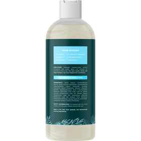 Close-up of shampoo label showing sulfate and paraben free formula.