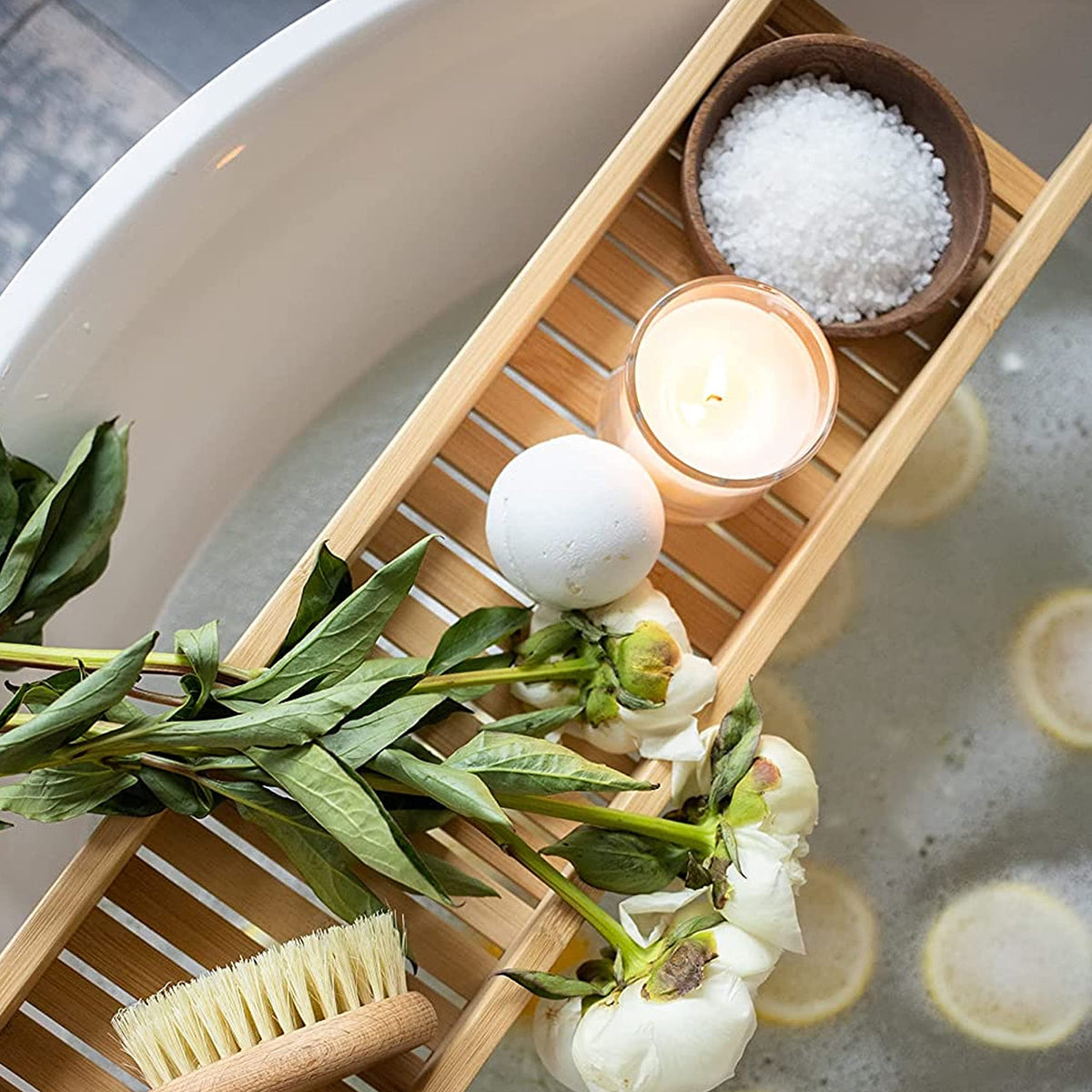 Marco Esra Dead Sea magnesium flakes in a bath scene for muscle relief.