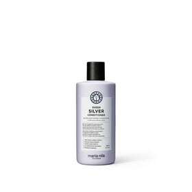 Maria Nila Sheer Silver bottle pour demonstrates violet pigment for neutralizing brass