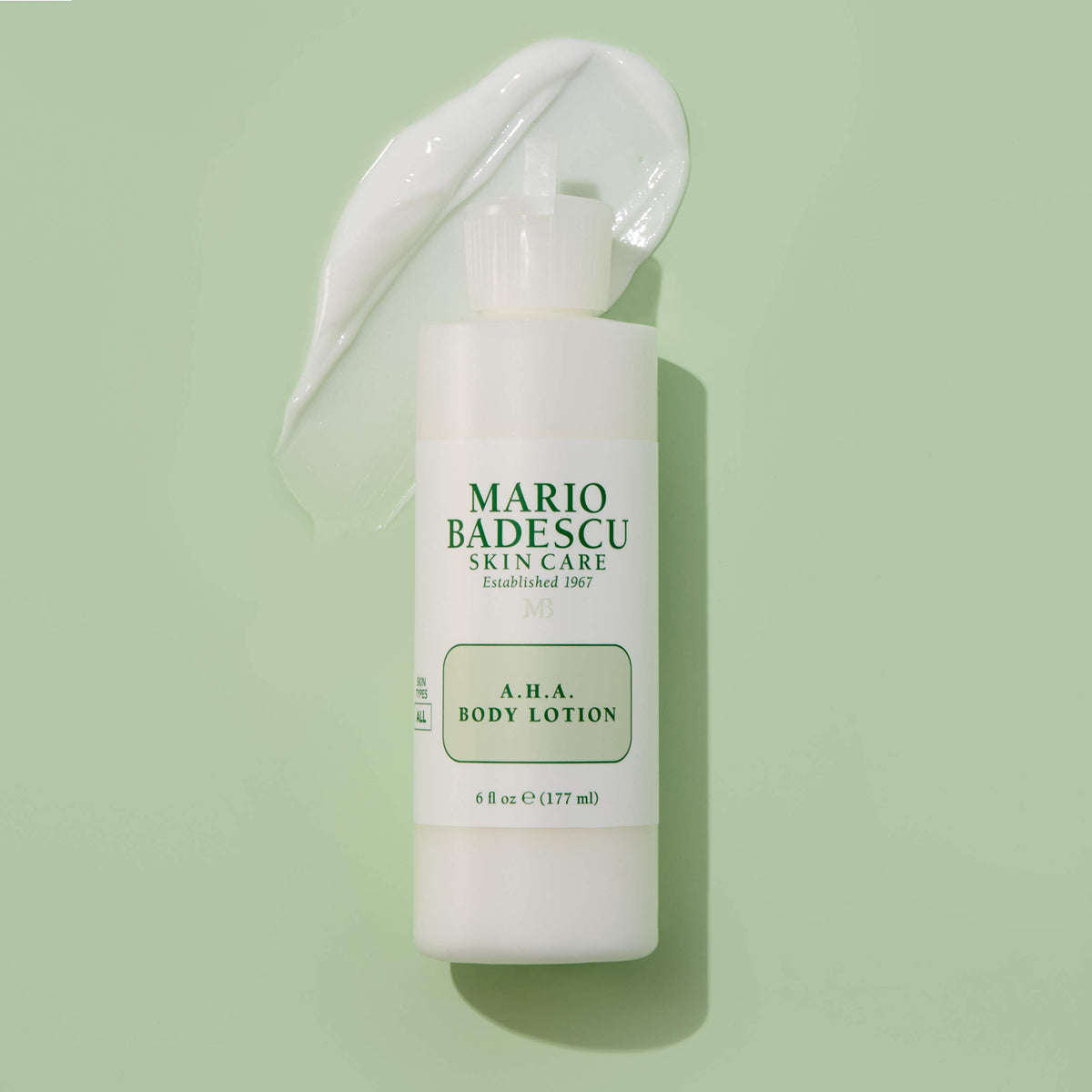 Mario Badescu AHA Body Lotion texture close-up showing a smooth, non-greasy feel