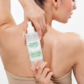 Mario Badescu Back and Body Clarifying Spray application on shoulders and back.