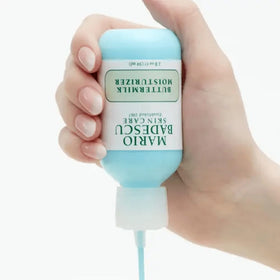 Applying Mario Badescu Buttermilk Moisturizer for a smooth, dewy finish on clean skin.