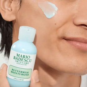 Mario Badescu Buttermilk Moisturizer cream texture shown, smoothing and absorbing for a radiant finish.
