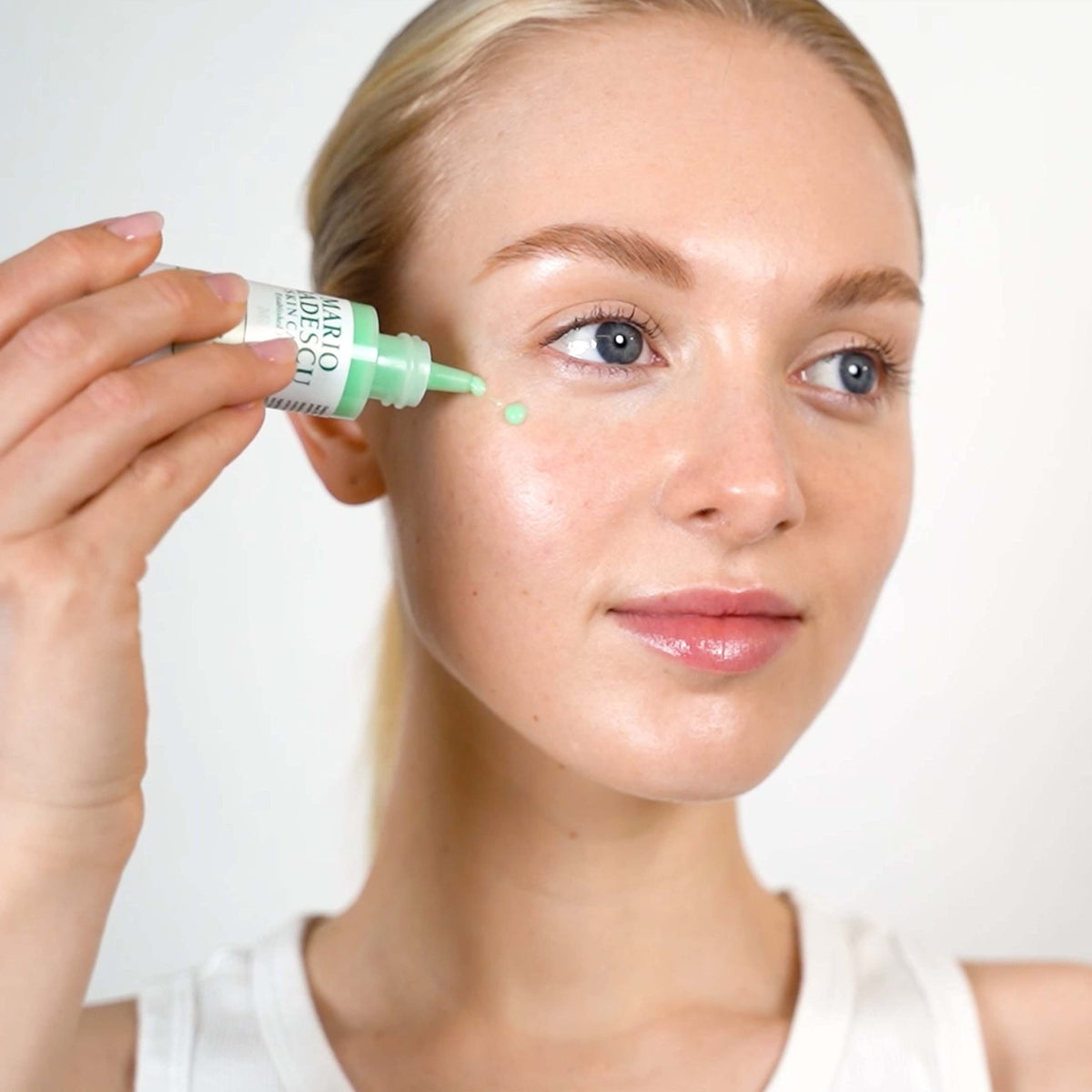 Mario Badescu Cellufirm Drops on the face demonstrates even application.
