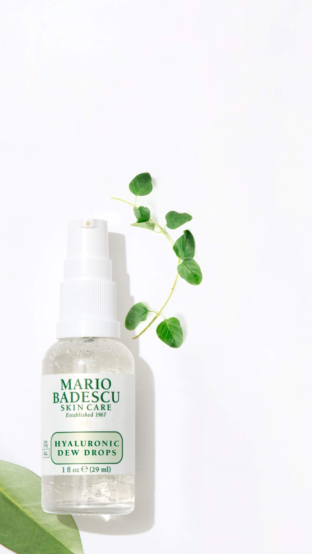 Mario Badescu Hyaluronic Dew Drops swatch on skin shows dewy finish