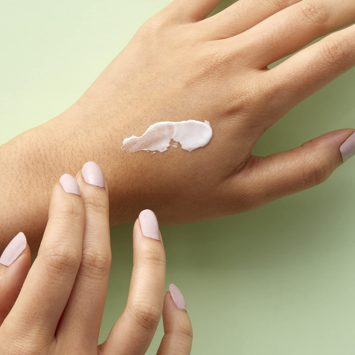 Texture of Mario Badescu Peptide Renewal Cream on skin showing hydration