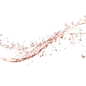 Close-up of Mario Badescu rosewater mist in mid-air for refresh
