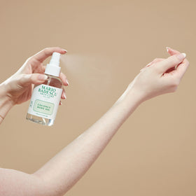 Mario Badescu Coconut Body Oil spray on skin for quick absorption