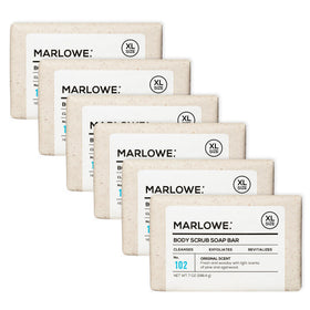 MARLOWE No. 102 body scrub bar close-up shows pumice for exfoliation.