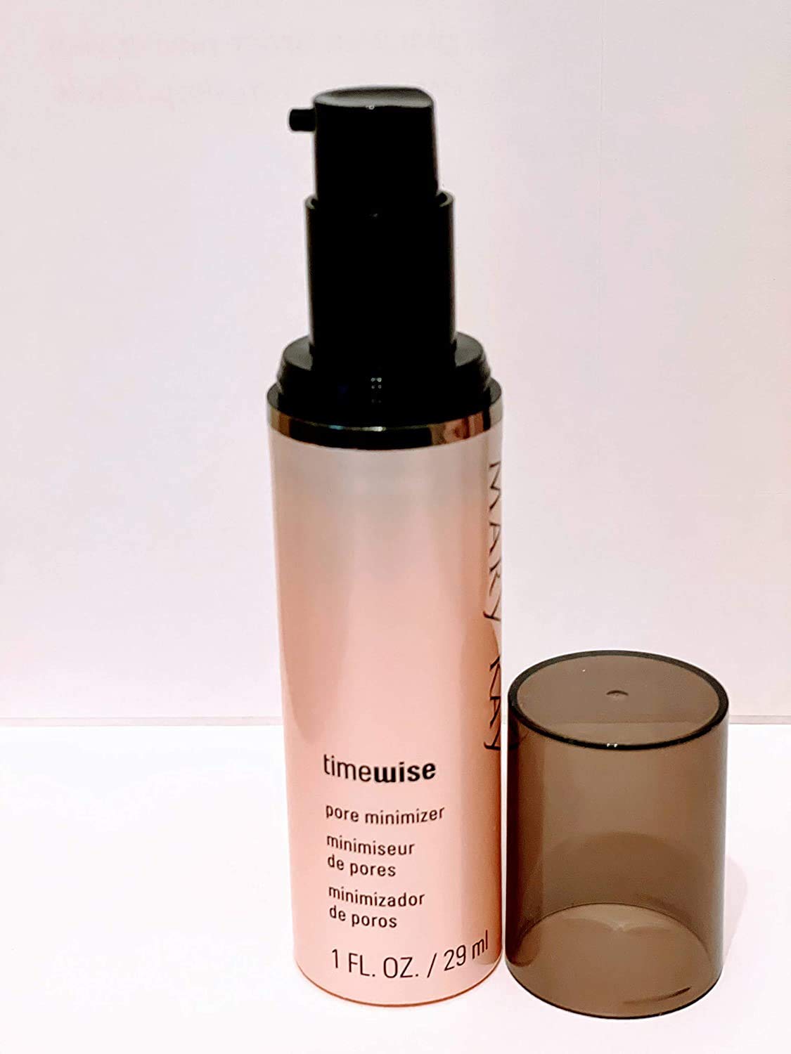 Mary Kay TimeWise Pore Minimizer bottle close-up showing pore refinement.