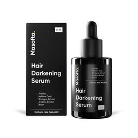 Masofta Anti Gray Hair Serum bottle pouring demonstrates lightweight, fast-absorbing texture for hair care.