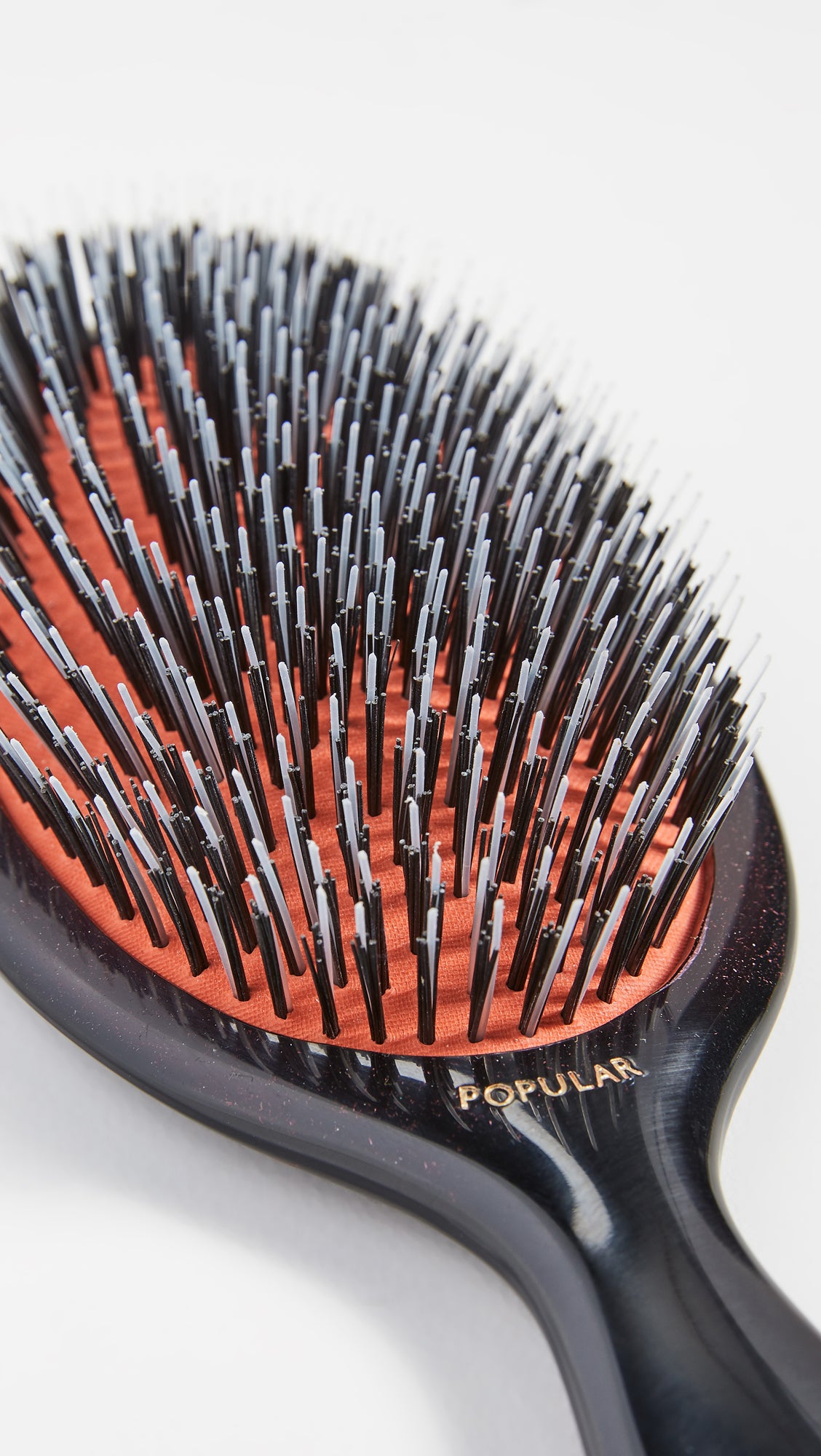 Mason Pearson Popular Mixture Brush handle closeup with ergonomic grip.