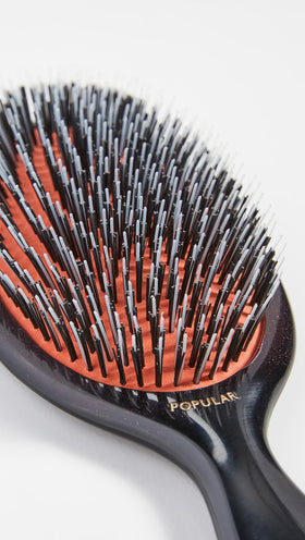 Mason Pearson Popular Mixture Brush handle closeup with ergonomic grip.