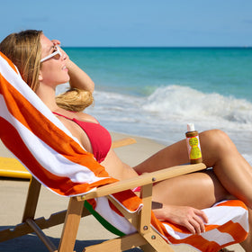 Maui Babe Browning Lotion application scene emphasizing sun-ready tanning acceleration
