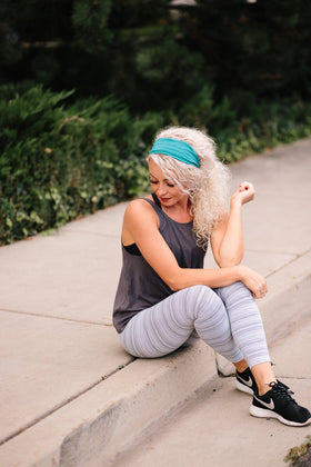 Maven Thread Bayside headband worn by a woman during a workout.