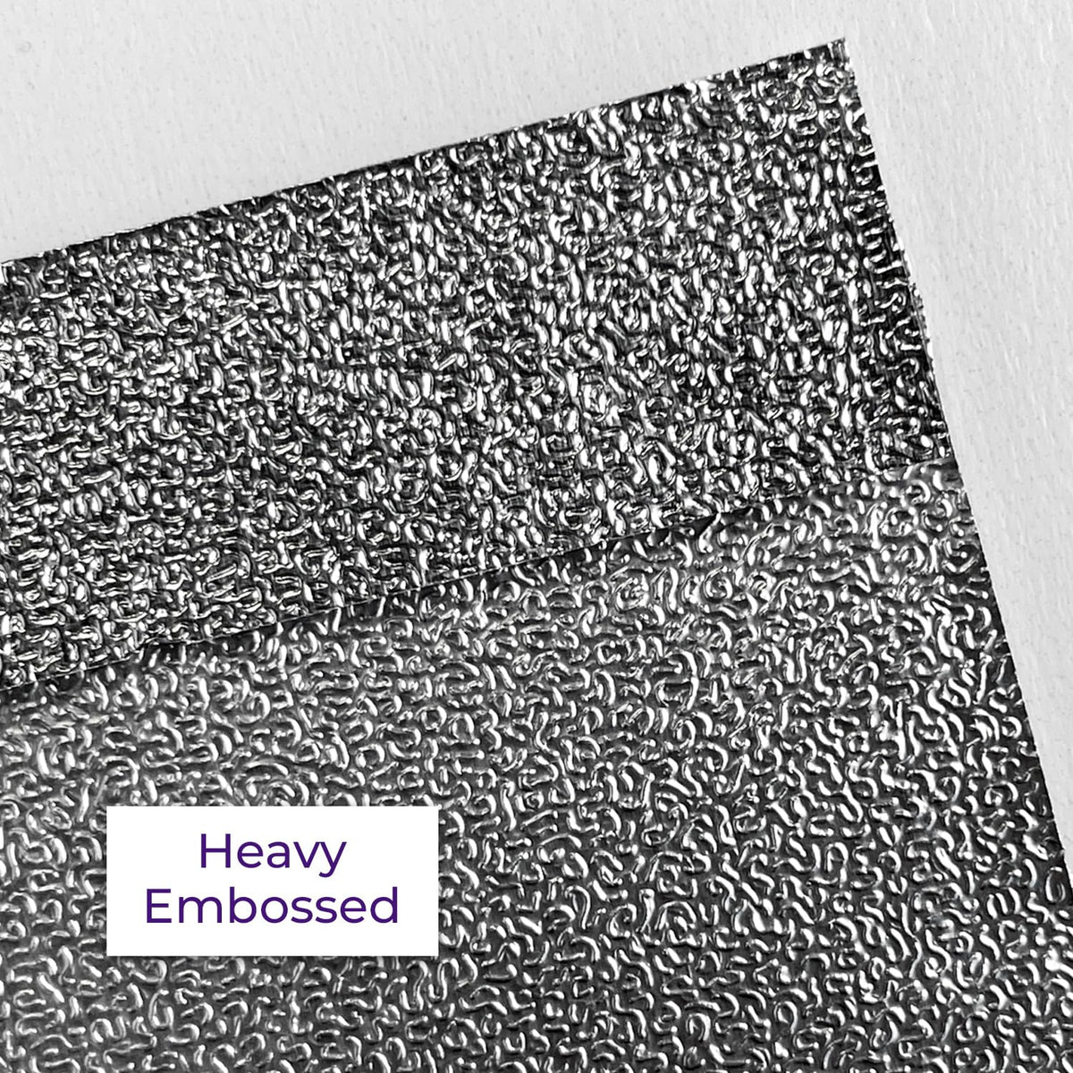Close-up of embossed grip on foil surface ensuring minimal slippage during layering.