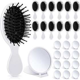 Meanplan mini detangler brush in white for gentle detangling across hair types.