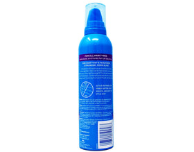 MECDY Finesse Extra Control Mousse styled hair with a brushable finish.