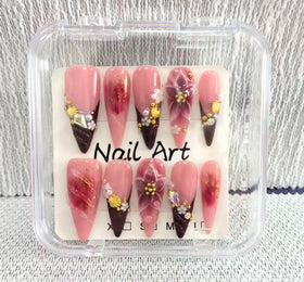 Meemooron nails featuring 3D flowers for a playful, eye-catching design.