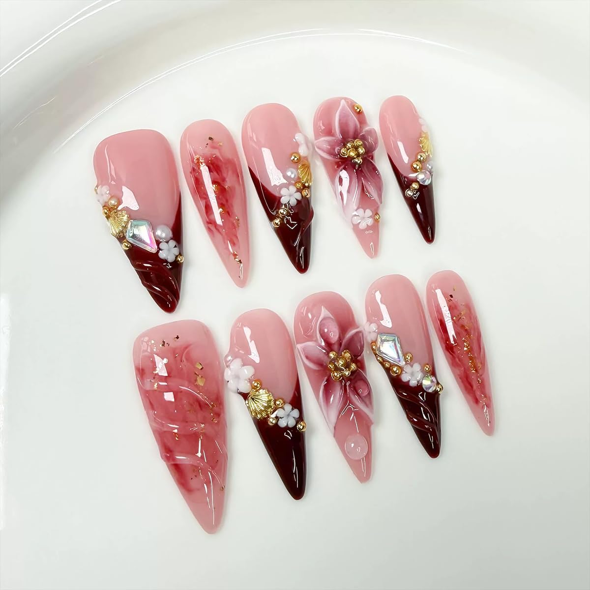 Meemooron long stilettos nails with red French tips for an elegant manicure.