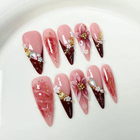 Meemooron long stilettos nails with red French tips for an elegant manicure.
