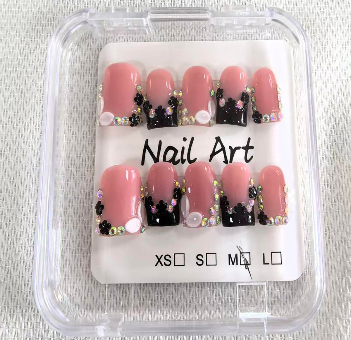 Meemooron nails with rhinestones and glossy black French tip for party styling